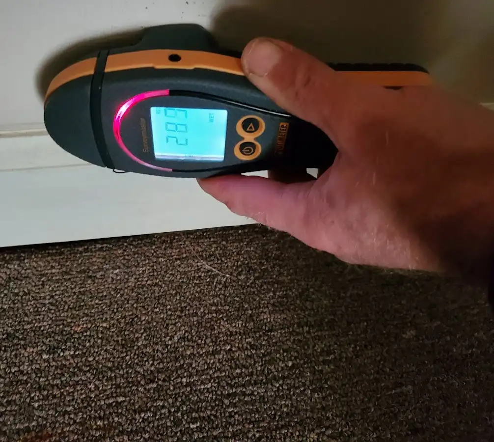 Moisture detection at baseboard during Storm Damage Restoration in Smyrna